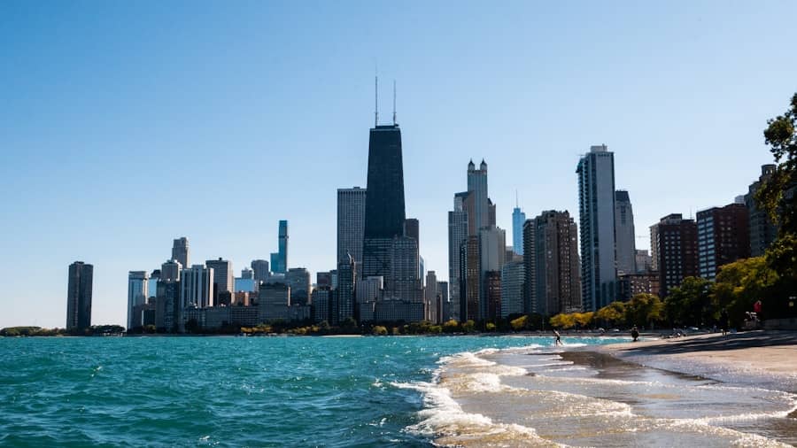 Chicago skyline viewed from a lakeside beach on a clear day.